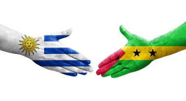 Sao Tome ve Principe ve Uruguay bayrakları arasındaki el sıkışma, izole şeffaf görüntü.