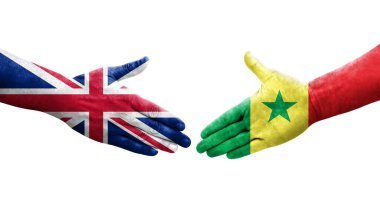 Senegal ve Birleşik Krallık bayrakları arasında el sıkışma, izole şeffaf görüntü.