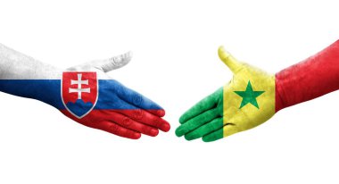 Senegal ve Slovakya bayrakları arasında el sıkışma, izole saydam görüntü.