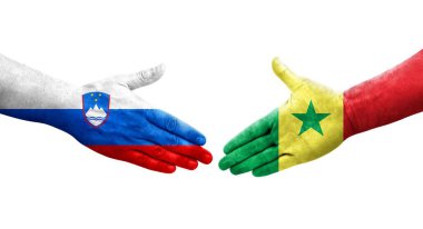 Ellerinde Senegal ve Slovenya bayrakları arasında el sıkışma, izole şeffaf görüntü.