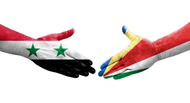 Seyşeller ve Suriye bayrakları arasında el sıkışma, izole şeffaf görüntü.