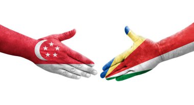 Seyşeller ve Singapur bayrakları arasındaki el sıkışma ellerinde izole şeffaf görüntü.