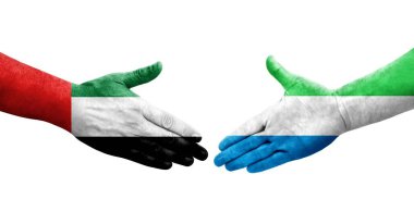 Sierra Leone ve BAE bayrakları arasındaki el sıkışma, izole şeffaf görüntü.