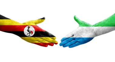 Sierra Leone ve Uganda bayrakları arasındaki el sıkışma, izole şeffaf görüntü.