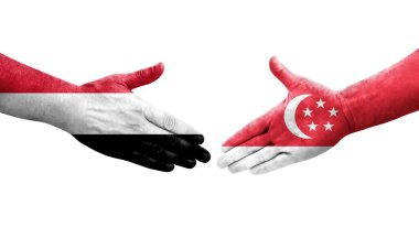 Singapur ve Yemen bayrakları arasındaki el sıkışma ellerinde resmedilmiş şeffaf görüntü.