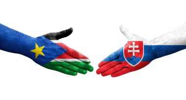 Slovakya ve Güney Sudan bayrakları arasındaki tokalaşma elleri boyalı, izole şeffaf görüntü.