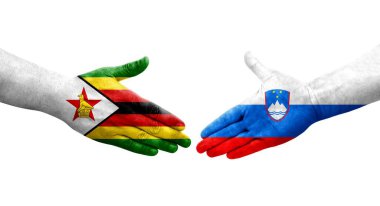 Slovenya ve Zimbabwe bayrakları arasındaki el sıkışma ellerinde resmedilmiş, izole şeffaf görüntü.