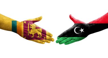 Sri Lanka ve Libya bayrakları arasındaki el sıkışma, izole edilmiş şeffaf görüntü.