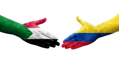 Sudan ve Kolombiya bayrakları arasında el sıkışma, izole şeffaf görüntü.
