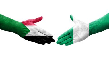 Sudan ve Nijerya bayrakları arasındaki el sıkışma ellerinde resmedilmiş şeffaf görüntü.