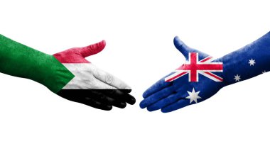 Sudan ve Avustralya bayrakları arasındaki tokalaşma elleri boyalı, izole şeffaf görüntü.