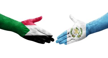 Sudan ve Guatemala bayrakları arasındaki tokalaşma elleri boyalı, izole şeffaf görüntü.