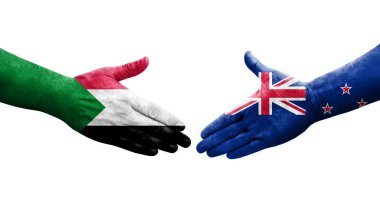 Sudan ve Yeni Zelanda bayrakları arasındaki tokalaşma elleri boyalı, izole şeffaf görüntü.