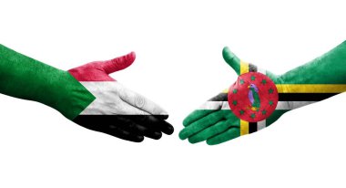 Sudan ve Dominica bayrakları arasındaki el sıkışma ellerinde resmedilmiş şeffaf görüntü.