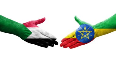 Sudan ve Etiyopya bayrakları arasındaki tokalaşma elleri boyalı, izole şeffaf görüntü.