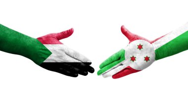 Sudan ve Burundi bayrakları arasındaki el sıkışma ellere boyanmış, izole şeffaf görüntü.