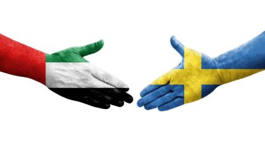 İsveç ve BAE bayrakları arasında el sıkışma, izole şeffaf görüntü.