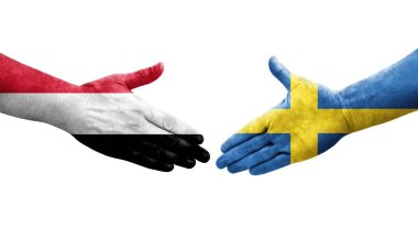 Ellerinde İsveç ve Yemen bayrakları arasında el sıkışma, izole şeffaf görüntü.