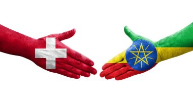 İsviçre ve Etiyopya bayrakları arasındaki el sıkışma ellerinde resmedilmiş şeffaf görüntü.