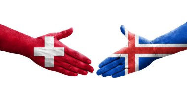 İsviçre ve İzlanda bayrakları arasındaki el sıkışma, izole edilmiş şeffaf görüntü.