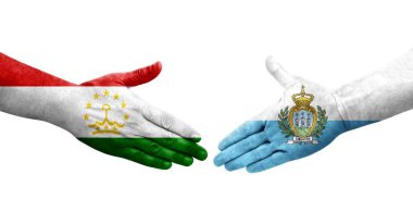 Tacikistan ve San Marino bayrakları arasında el sıkışma, izole şeffaf görüntü.