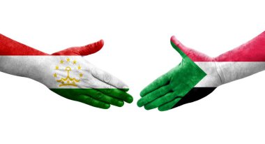 Tacikistan ve Sudan bayrakları arasındaki el sıkışma, izole şeffaf görüntü.