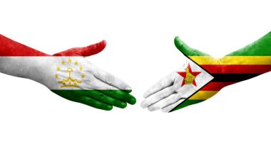 Tacikistan ve Zimbabwe bayrakları arasındaki el sıkışma, izole şeffaf görüntü.