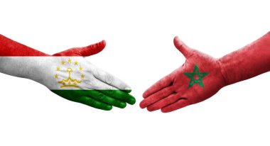 Tacikistan ve Fas bayrakları arasındaki el sıkışma, izole şeffaf görüntü.