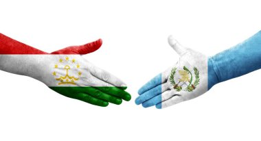 Tacikistan ve Guatemala bayrakları arasındaki el sıkışma, izole şeffaf görüntü.