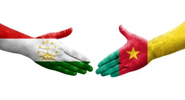 Tacikistan ve Kamerun bayrakları arasındaki el sıkışma, izole şeffaf görüntü.