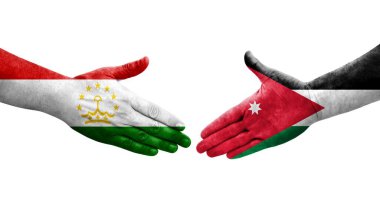 Tacikistan ve Ürdün bayrakları arasındaki el sıkışma ellerinde resmedilmiş şeffaf görüntü.