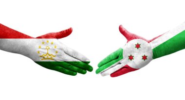 Tacikistan ve Burundi bayrakları arasındaki tokalaşma elleri boyalı, izole şeffaf görüntü.