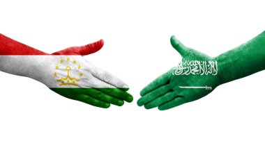 Tacikistan ve Suudi Arabistan bayrakları arasındaki el sıkışma, izole şeffaf görüntü.