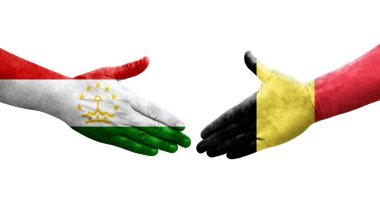 Tacikistan ve Belçika bayrakları arasındaki el sıkışma, izole şeffaf görüntü.