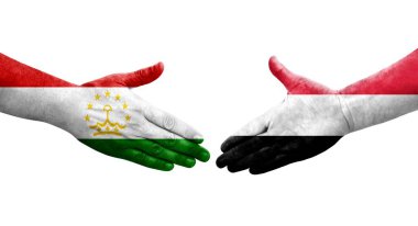 Tacikistan ve Yemen bayrakları arasındaki el sıkışma ellerinde resmedilmiş şeffaf görüntü.