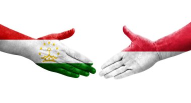 Tacikistan ve Monako bayrakları arasındaki el sıkışma, izole şeffaf görüntü.