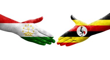 Tacikistan ve Uganda bayrakları arasındaki el sıkışma, izole şeffaf görüntü.