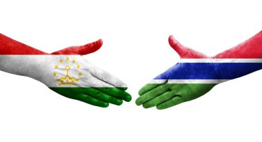 Tacikistan ve Gambiya bayrakları arasında el sıkışma, izole şeffaf görüntü.
