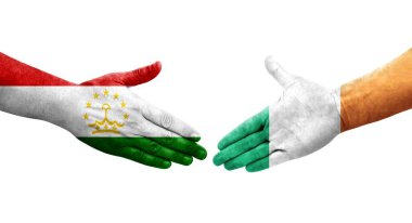 Tacikistan ve İrlanda bayrakları arasındaki el sıkışma, izole şeffaf görüntü.