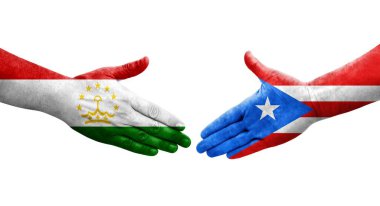 Tacikistan ve Porto Riko bayrakları arasındaki tokalaşma ellerinde izole şeffaf görüntü.
