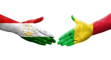 Ellerine Tacikistan ve Mali bayrakları arasında el sıkışma, izole şeffaf görüntü.