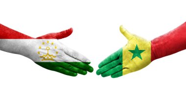 Tacikistan ve Senegal bayrakları arasındaki el sıkışma, izole şeffaf görüntü.
