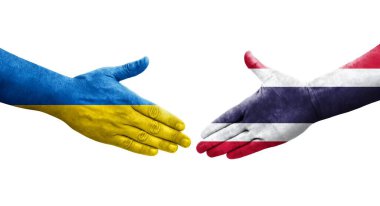 Tayland ve Ukrayna bayrakları arasında el sıkışma, izole şeffaf görüntü.