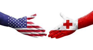Tonga ve ABD bayrakları arasındaki tokalaşma elleri boyalı, izole şeffaf görüntü.