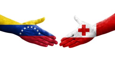 Tonga ve Venezuela bayrakları arasındaki tokalaşma elleri boyalı, izole şeffaf görüntü.