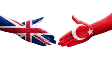 Türkiye ile Birleşik Krallık bayrakları arasında el sıkışma, izole şeffaf görüntü.