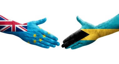 Tuvalu ve Bahamalar arasındaki el sıkışma ellerinde boyanmış bayraklar, yalıtılmış şeffaf görüntü.