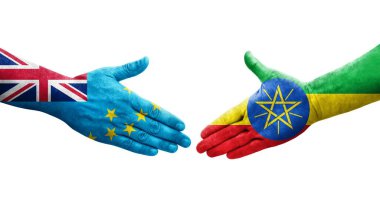 Tuvalu ve Etiyopya bayrakları arasındaki tokalaşma elleri boyalı, izole şeffaf görüntü.
