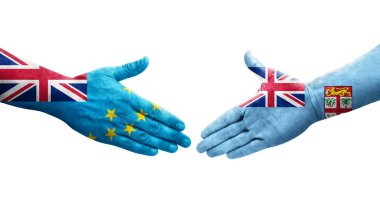 Tuvalu ve Fiji bayrakları arasındaki el sıkışma ellerinde resmedilmiş şeffaf görüntü.