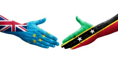 Tuvalu ve Saint Kitts ve Nevis bayrakları arasındaki tokalaşma ellerinde izole şeffaf görüntü.